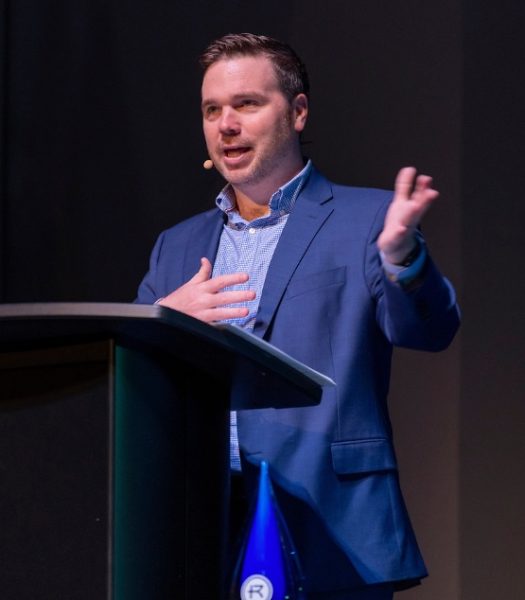 Kevin Roose speaking on “leading with integrity in the AI world” at the Kauffman Center for the Performing Arts. Photo provided by Rockhurst Marketing.