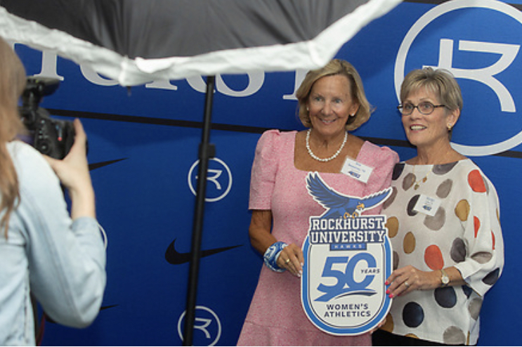 Attendees pose for a photo at the 50 Years of Womens Athletics Blue Carpet Reception and Celebration Program. Photo provided by Rockhurst Marketing.