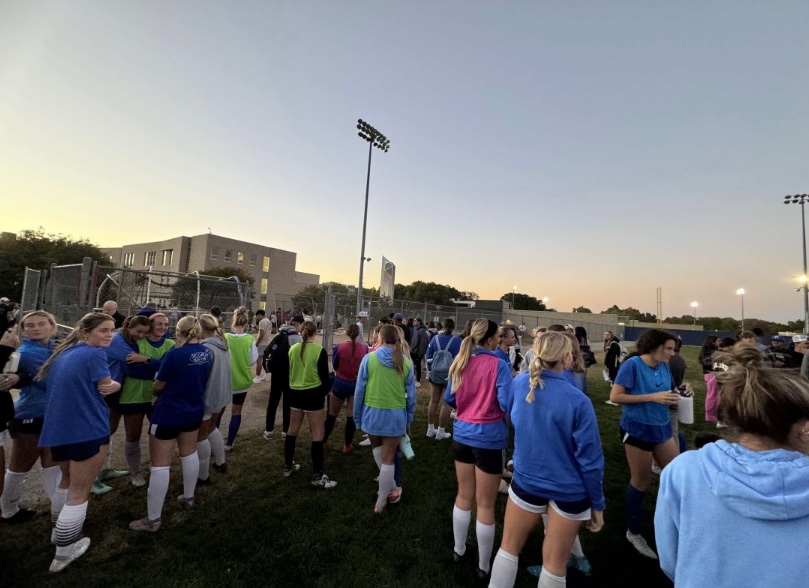 Rockhurst students, faculty and staff evacuate to the baseball field during a bomb threat on October 16, 2024.