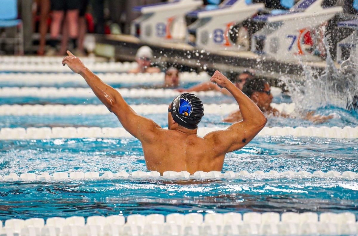 Ali Usama celebrates after winning the 50-yard freestyle at the 2025 GLVC Men’s and Women’s Swimming & Diving Championships. Photo by Jared McFarlane.